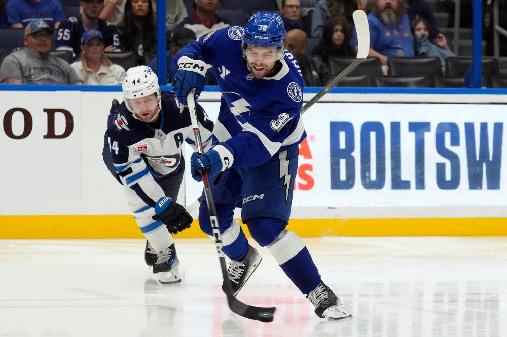 Chris O'Meara / The Associated Press
Tampa Bay Lightning left wing Brandon Hagel shoots after getting around Winnipeg Jets defenceman Josh Morrissey during the second period, Thursday in Tampa.