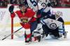 Lynne Sladky / The Associated Press
                                Florida Panthers centreman Evan Rodrigues, left, reacts after scoring on Winnipeg Jets goaltender Connor Hellebuyck in the second period of the Panther’s 5-0 win, Saturday in Sunrise, Fla.