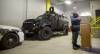 MIKE DEAL / WINNIPEG FREE PRESS Winnipeg police tactical support team member Const. Tyler Loewen discusses the role of the WPS armoured vehicle and the toll the incident took on officers at the scene in the recent shooting standoff on Bannerman while standing in front of a bullet damaged police cruiser and the ARV1 inside police headquarters. 181116 - Friday, November 16, 2018.