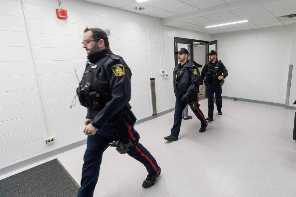 Police at the Allen Building at the University of Manitoba campus Tuesday morning. (Mike Deal / Free Press)