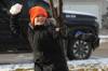 TIM SMITH / BRANDON SUN FILES
                                Harvey Reichert, 9, throws a snowball while playing with his sister, Amara, on Monday after Brandon&rsquo;s first snowfall on the weekend.