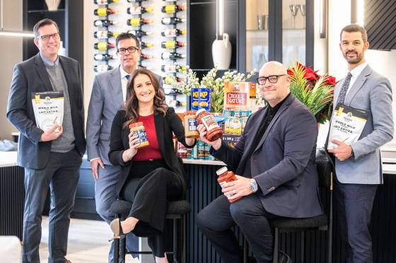 Moore Group realtors David Van Benthem (left), Reid Boles, Stephanie Baron, Scott Moore and Phil Gear are gearing up for their eighth annual food drive in support of William Whyte school, a Kindergarten to Grade 8 school in the North End. (Mikaela MacKenzie / Free Press)
