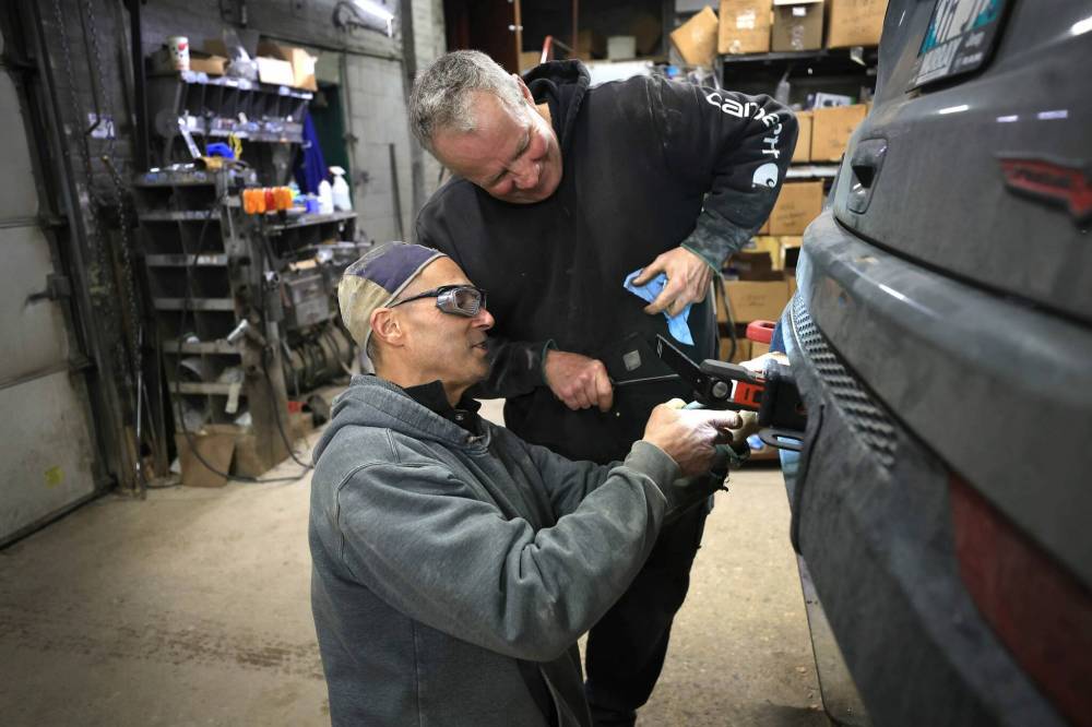 RUTH BONNEVILLE / FREE PRESS
Don Jones (left), and Mark Nichols are the only employees of Mitchell Welding, along with shop owner Ed Nichols.