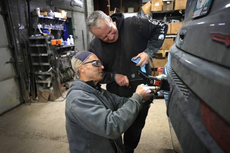 RUTH BONNEVILLE / FREE PRESS BIZ - Mitchell Welding Photos of the shop’s only two employees: Don Jones (hat), and Mark Nichols ( Ed’s younger brother), working. Ed Nichols, owner of Mitchell Welding, a 128-year-old company that specializes in trailer hitch installation and repair that he took over from his father-in-law. Story by Aaron Nov. 22 ‘Made in Manitoba’ article Nov 20th, 2024