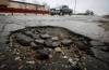 A pothole on Empress Street Sunday. (John Woods / Free Press)