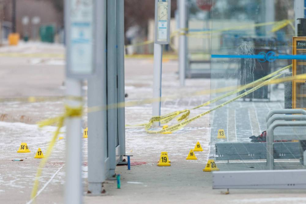 MIKE DEAL / FREE PRESS
Winnipeg police were still at the scene Monday morning after a fatal police shooting Sunday evening near a bus shelter in the Unicity shopping centre parking lot in the 3600 block of Portage Avenue.