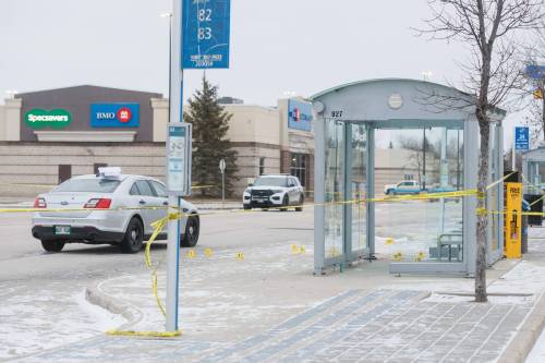 MIKE DEAL / FREE PRESS Winnipeg Police are still at the scene Monday morning at the bus stop in the parking lot of a Walmart (3655 Portage Avenue) where an officer involved shooting occurred happened Sunday evening. Winnipeg police shot and killed a male outside a bus shelter at a west Winnipeg shopping area Sunday after they say he stabbed an officer in the throat. 241125 - Monday, November 25, 2024.
