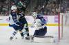 ABBIE PARR / THE ASSOCIATED PRESS
                                Connor Hellebuyck makes one of his 43 saves Monday night with the help of Ville Heinola as Wild centre Marcus Johansson crowds the crease in St. Paul, Minn.