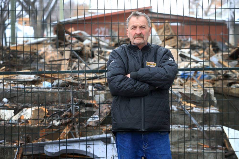 RUTH BONNEVILLE / FREE PRESS
Darrell Warren, president of the William Whyte Neighbourhood Association, stands next to a demolished home at 657 Alfred Ave. Tuesday. Flames engulfed the home earlier Tuesday morning and it was demolished soon after.