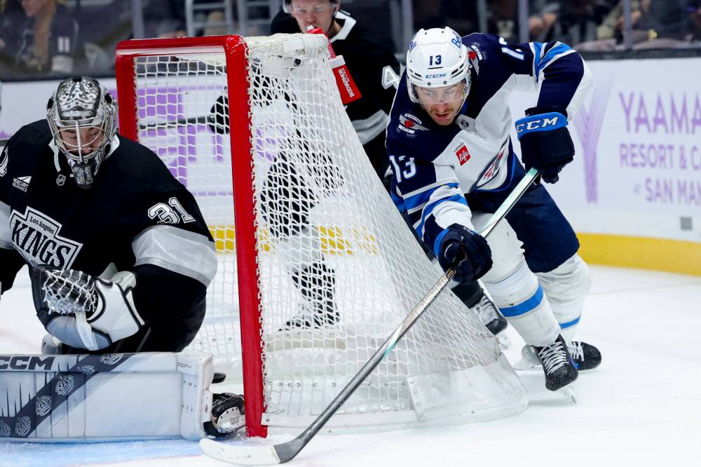 Winnipeg Jets’ Gabriel Vilardi, right, attempts a backhand wrap around shot against Los Angeles Kings goaltender David Rittich in the first period. (AP Photo/Ryan Sun)