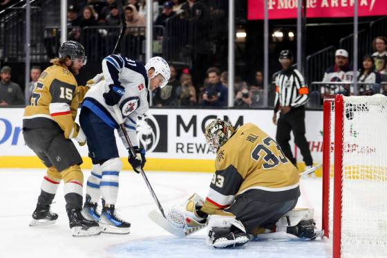 Cole Perfetti scores on Vegas Golden Knights goaltender Adin Hill in the first period, Friday.  Ian Maule / The Associated Press