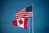 Canadian and U.S. flags fly atop the Peace Arch monument at the Douglas-Peace Arch border crossing in Surrey, B.C. THE CANADIAN PRESS/Darryl Dyck