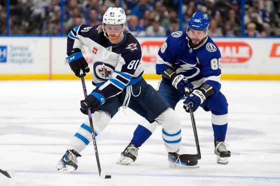 Winnipeg Jets left wing Kyle Connor (81) skates around Tampa Bay Lightning right wing Nikita Kucherov (86) during a matchup in Tampa last season Kucherov is expected to get a lot of ice time in tonight's game. (Chris O'Meara/Associated Press files)