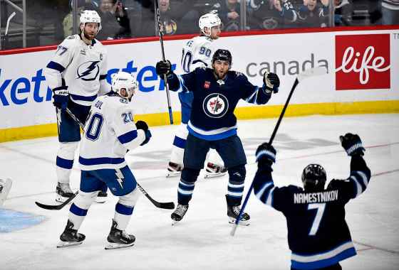 Winnipeg Jets left wing Alex Iafallo (9) celebrates his third-period goal against the Tampa Bay Lightning with teammate Vladislav Namestnikov (7) during Sunday's game. (Fred Greenslade /The Canadian Press files)