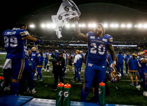 Winnipeg Blue Bombers' Brady Oliveira (20) celebrates on the bench against the Saskatchewan Roughriders during the second half of CFL Western Conference final action in Winnipeg Saturday, November 9, 2024.    THE CANADIAN PRESS/John Woods