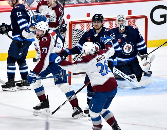 Colorado Avalanche's Yakov Trenin (73) celebrates his goal on Winnipeg Jets goaltender Connor Hellebuyck (37) in Game 5 of last season's first-round playoffs.  (Fred Greenslade / The Canadian Press files)