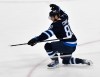 Winnipeg Jets' Kyle Connor (81) celebrates his game-winning goal against the Minnesota Wild during overtime NHL hockey action in Winnipeg, Sunday, Oct. 13, 2024. THE CANADIAN PRESS/Fred Greenslade