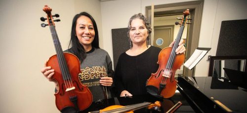 MIKAELA MACKENZIE / FREE PRESS
	
Metis fiddling instructor Patti Kusturok (right) and Indigenous Studies grad student Krysta Alexson at the University of Manitoba on Tuesday, Nov. 26, 2024. The new class is the first of its kind in Canada, and was inspired by reconciliation.

For Scott story.
Winnipeg Free Press 2024