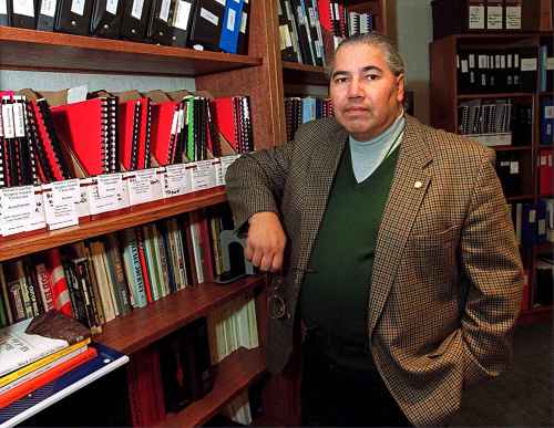 Judge Murray Sinclair poses for a photo in his office on Nov. 12, 1999, with documents from baby death inquiry. Sinclair said in a damning inquest report released Monday Nov.27, 2000, that of 12 babies who died after or during heart surgery at Winnipeg's largest hospital, at least 10 might have survived with proper treatment. (CP PHOTO/Winnipeg Free Press-Wayne Glowacki)