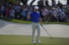 Rory McIlroy of Northern Ireland acknowledges the crowd after scoring a birdie on the 9th green in the final round of World Tour Golf Championship in Dubai, United Arab Emirates, Sunday, Nov. 17, 2024. (AP Photo/Altaf Qadri)