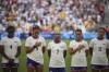 FILE - From left; United States' Naomi Girma, Trinity Rodman, Crystal Dunn, Mallory Swanson and Sophia Smith listen to the national anthem ahead of a women's Group B soccer match between Australia and the United States, at the Marseille Stadium during the 2024 Summer Olympics, Wednesday, July 31, 2024, in Marseille, France. (AP Photo/Daniel Cole, File)