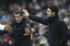 Arsenal's manager Mikel Arteta, right, and Fulham's head coach Marco Silva react during the English Premier League soccer match between Fulham and Arsenal, at the Craven Cottage Stadium in London, Sunday, Dec. 8, 2024. (AP Photo/Dave Shopland)