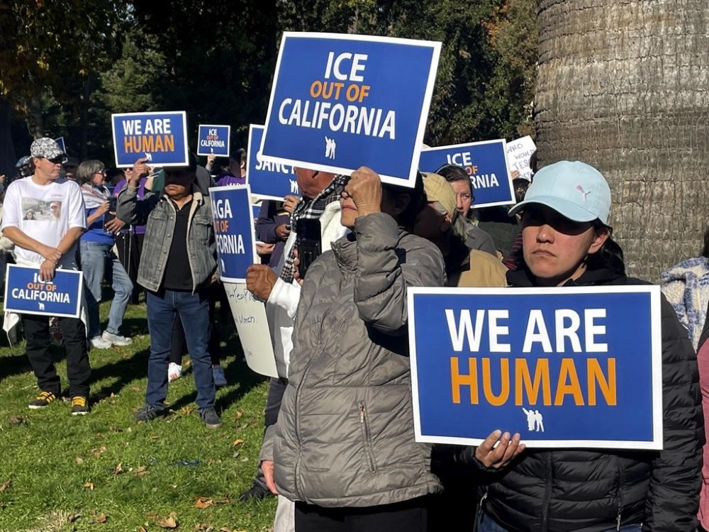 Immigration advocates hold a rally in Sacramento, Calif. on Monday, Dec. 2, 2024, to protest President-Elect Donald Trump's plans to conduct mass deportation of immigrants without legal status. (AP Photo/Haven Daley)