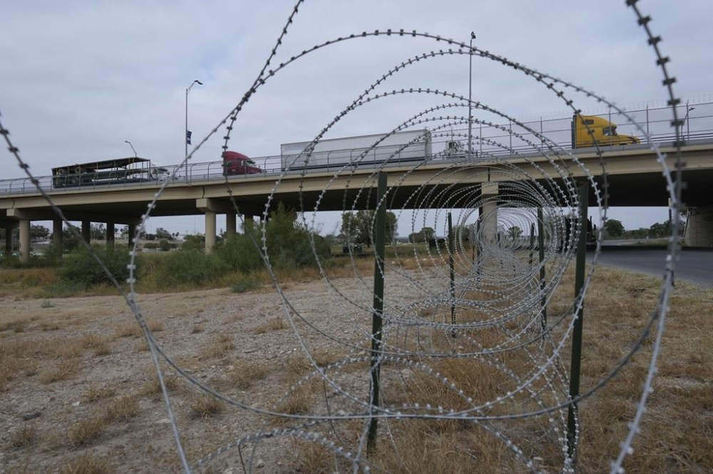 Trucks cross the International Bridge from Mexico into the United States, Tuesday, Nov. 26, 2024, in Eagle Pass, Texas. (AP Photo/Eric Gay)