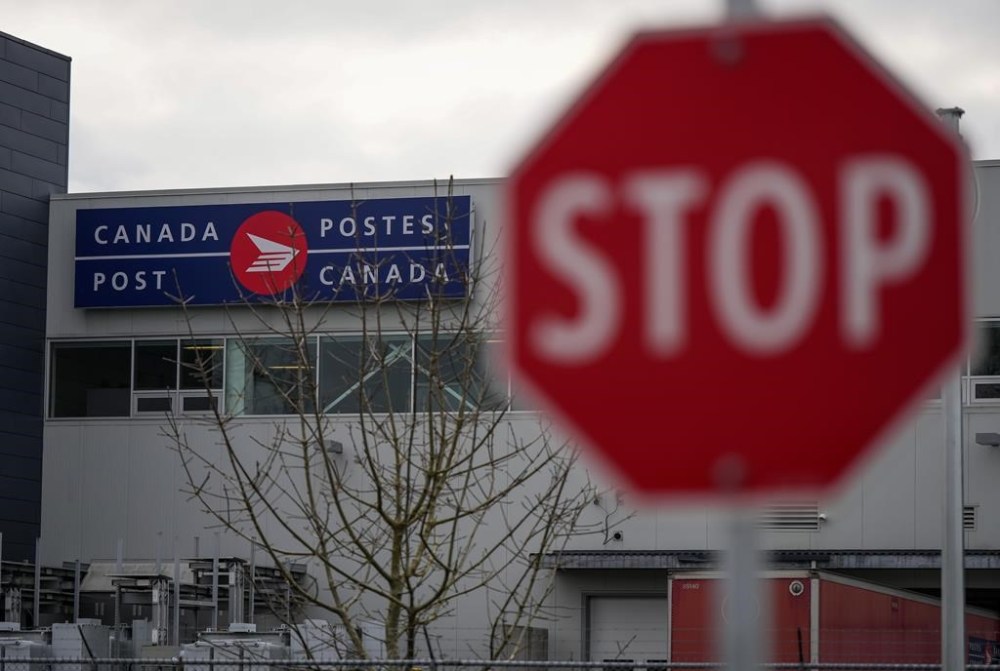 A Canada Post logo is seen on the outside of the Pacific Processing Centre in Richmond, B.C. on Wednesday, November 27, 2024. THE CANADIAN PRESS/Darryl Dyck