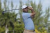 Scottie Scheffler, of the United States, watches his drive on the third hole during the final round of the Hero World Challenge PGA Tour at the Albany Golf Club, in New Providence, Bahamas, Sunday, Dec. 8, 2024. (AP Photo/Fernando Llano)