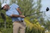 Scottie Scheffler, of the United States, tees off on the third hole during the final round of the Hero World Challenge PGA Tour at the Albany Golf Club, in New Providence, Bahamas, Sunday, Dec. 8, 2024. (AP Photo/Fernando Llano)