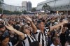 Fans of Brazil's Botafogo cheer during their team's homecoming parade after winning the Copa Libertadores soccer tournament, in Rio de Janeiro, Sunday, Dec. 1, 2024. (AP Photo/Bruna Prado)