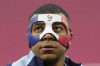 FILE - France's Kylian Mbappe looks up as he wears a face mask during a team training session in Leipzig, Germany, Thursday, June 20, 2024. (AP Photo/Hassan Ammar, file)