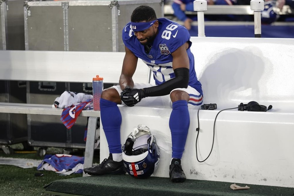 New York Giants wide receiver Darius Slayton (86) sits on the bench after an NFL football game against the New Orleans Saints, Sunday, Dec. 8, 2024, in East Rutherford, N.J. (AP Photo/Adam Hunger)