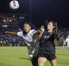 North Carolina's Olivia Thomas and Wake Forest's Sierra Sythe (19) battle for a ball during the first half of NCAA Women's College Cup soccer final in Cary, N.C., Monday, Dec. 9, 2024. (AP Photo/Ben McKeown)
