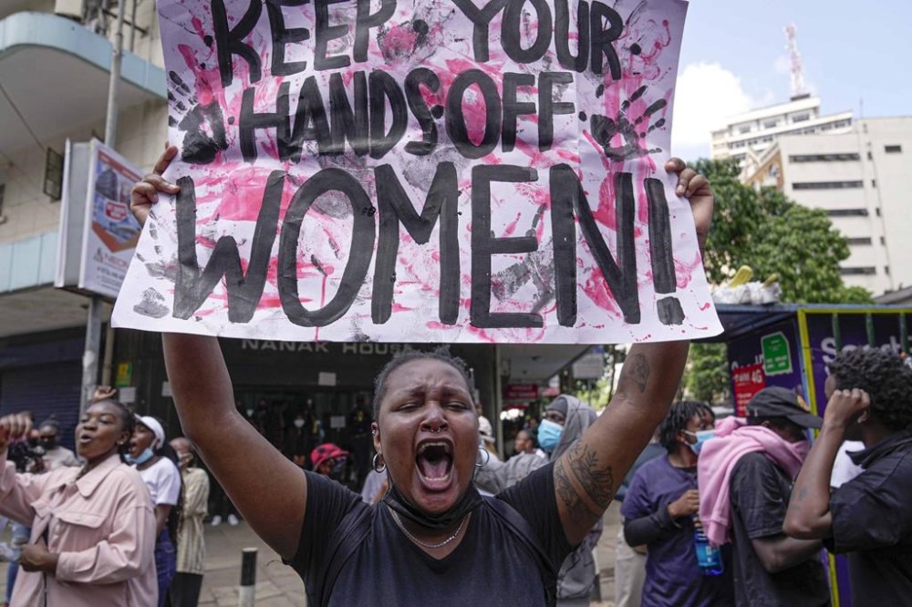 A protester shouts as she holds a placard during a march against the rising cases of femicide, in downtown Nairobi, Kenya, Tuesday, Dec. 10, 2024. (AP Photo/Brian Inganga)