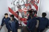 Trainees walk past a wall displaying the club's famous players in the AS Monaco academy in Cap d'Ail near Monaco, Wednesday, Dec. 4, 2024. (AP Photo/Lewis Joly)