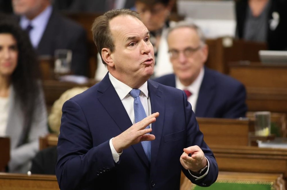 Minister of Labour and Seniors Steven MacKinnon rises during Question Period in the House of Commons on Parliament Hill in Ottawa on Thursday, Dec. 5, 2024. The union representing British Columbia port supervisors in dispute with their employers has applied for a judicial review of federal Labour Minister Steven MacKinnon's decision last month to order them back to work. THE CANADIAN PRESS/Patrick Doyle