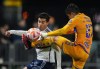 Tigres UANL's Jesus Alberto Angulo, right, and Vancouver Whitecaps' Brian White vie for the ball during the second half of a CONCACAF Champions Cup soccer match, in Langford, B.C., on Wednesday, Feb. 7, 2024. THE CANADIAN PRESS/Darryl Dyck