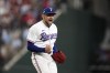 FILE - In this Oct. 10, 2023, photo, Texas Rangers starting pitcher Nathan Eovaldi celebrates on the mound after getting an out against the Baltimore Orioles in Game 3 of an American League Division Series baseball game in Arlington, Texas. (AP Photo/Tony Gutierrez, file)