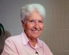 FILE - In this Oct. 9, 2014, file photo, Australian Olympic swimming great Dawn Fraser smiles during an interview in Tokyo.(AP Photo/Haruka Nuga, File)
