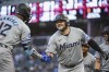 FILE - Miami Marlins' Jake Burger, right, celebrates with Jesus Sanchez after hitting a three-run home run off of Minnesota Twins starting pitcher Simeon Woods Richardson in the first inning of a baseball game, Wednesday, Sept. 25, 2024, in Minneapolis. (AP Photo/Craig Lassig, File)