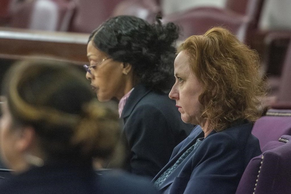 Former Brunswick Judicial Circuit District Attorney Jackie Johnson listens Wednesday, Dec. 11, 2024, at the Glynn County Courthouse in Brunswick, Georgia, prior to a pretrial motions hearing in her violation of oath office case. (Michael Hall/Pool Photo via AP)