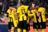 Young Boys' Lukasz Lakomy, second from left, celebrates with teammates after scoring the opening goal during the Champions League opening phase soccer match between VfB Stuttgart and Young Boys in Stuttgart, Germany, Wednesday, Dec. 11, 2024. (Tom Weller/dpa via AP)