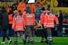 Dortmund's Nico Schlotterbeck is carried off the pitch following an injury during the Champions League opening phase soccer match between Borussia Dortmund and FC Barcelona at the Signal-Iduna Park in Dortmund, Germany, Wednesday Dec. 11, 2024. (Bernd Thissen/dpa via AP)