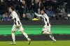 Juventus' Weston McKennie, right, celebrates his side's second goal during the Champions League, opening phase soccer match between Juventus and Manchester City at the Allianz stadium in Turin, Italy, Tuesday, Wednesday, Dec.11, 2024. (AP Photo/Luca Bruno)