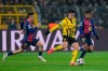Dortmund's Giovanni Reyna fights for the ball against Barcelona's Marc Casado and Lamine Yamal during the Champions League opening phase soccer match between Borussia Dortmund and FC Barcelona at the Signal-Iduna Park in Dortmund, Germany, Wednesday Dec. 11, 2024. (AP Photo/Martin Meissner)