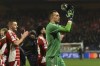 Brest's goalkeeper Marco Bizot claps hands after the end of the Champions League opening phase soccer match between Brest and PSV Eindhoven in Roudourou stadium, Guingamp, France, Tuesday, Dec. 10, 2024. Brest won 1-0.(AP Photo/Mathieu Pattier)