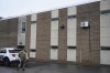 A law enforcement officer walks into the Altoona Police Department, where suspect in the UnitedHealthcare CEO shooting, 26-year old Luigi Mangione is being held Monday, Dec. 9, 2024, Altoona, Pa. (Benjamin B. Braun/Pittsburgh Post-Gazette via AP)