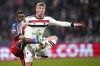 Manchester United's Rasmus Hojlund, right, challenges for the ball with Plzen's Sampson Dweh during the Europa League soccer match between Viktoria Plzen and Manchester United at the Doosan Arena in Plzen, Czech Republic, Thursday, Dec. 12, 2024. (AP Photo/Petr David Josek)